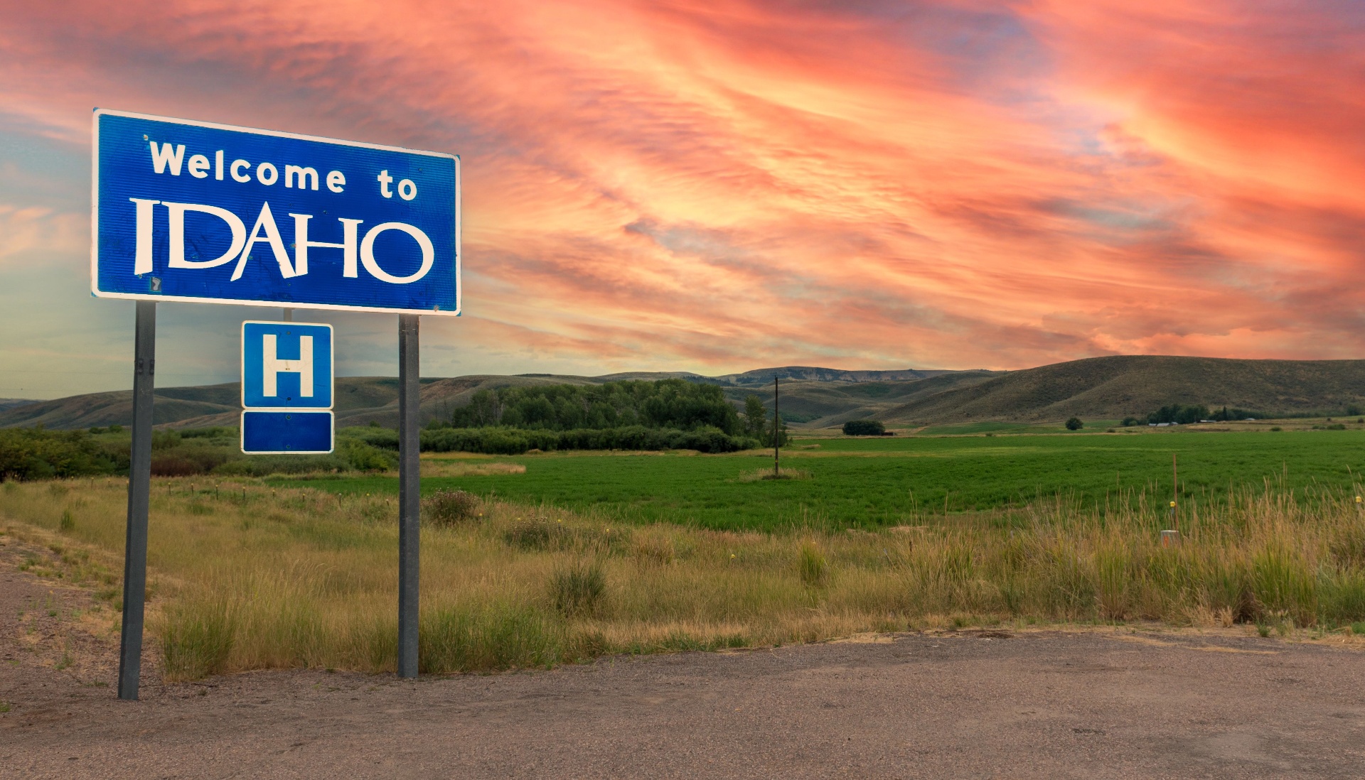 Welcome to Idaho roadside sign at sunset
